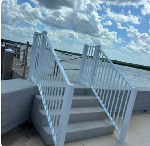 White vinyl railing and stair rail on a riverfront dock